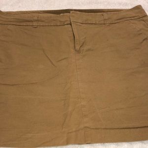 Khaki mini skirt.